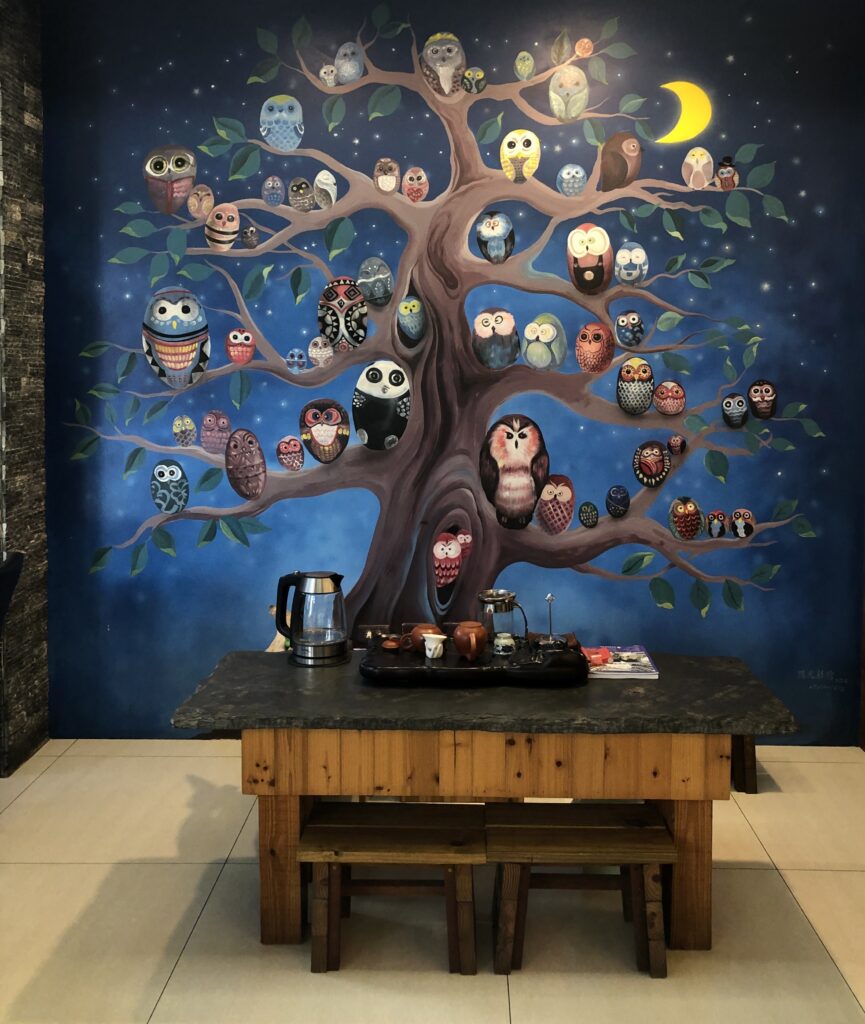 owl mural on the hostel wall